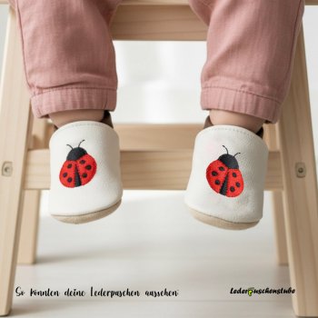 Lederpuschen Marienkäfer rot Designbeispiel am Baby